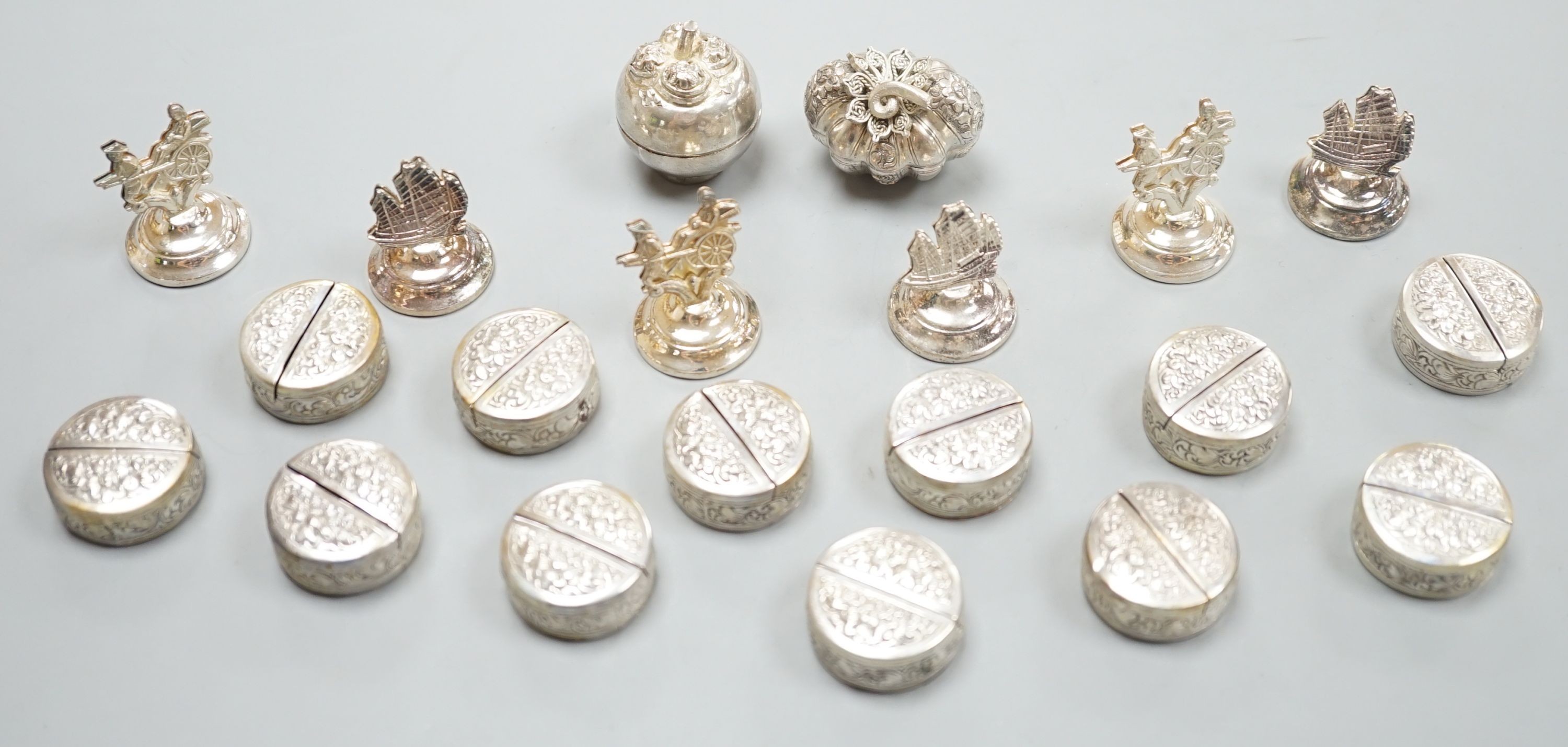 Six Hong Kong sterling menu holders and twelve Cambodian 900 standard white metal place setting holders and two Balinese boxes.